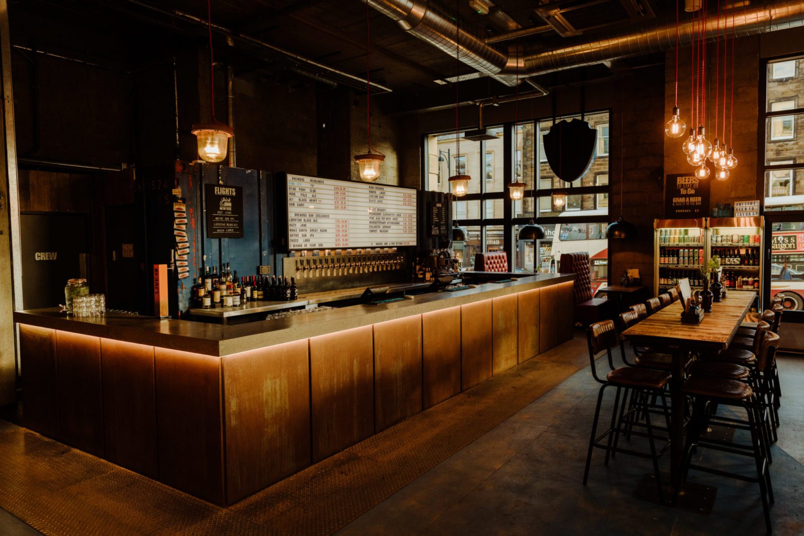 Stylish BrewDog Lothian Road bar with communal table for networking events and gatherings.