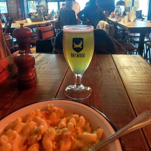 Beer garden at BrewDog Lothian Road with wooden table, ideal for networking events and casual dining.