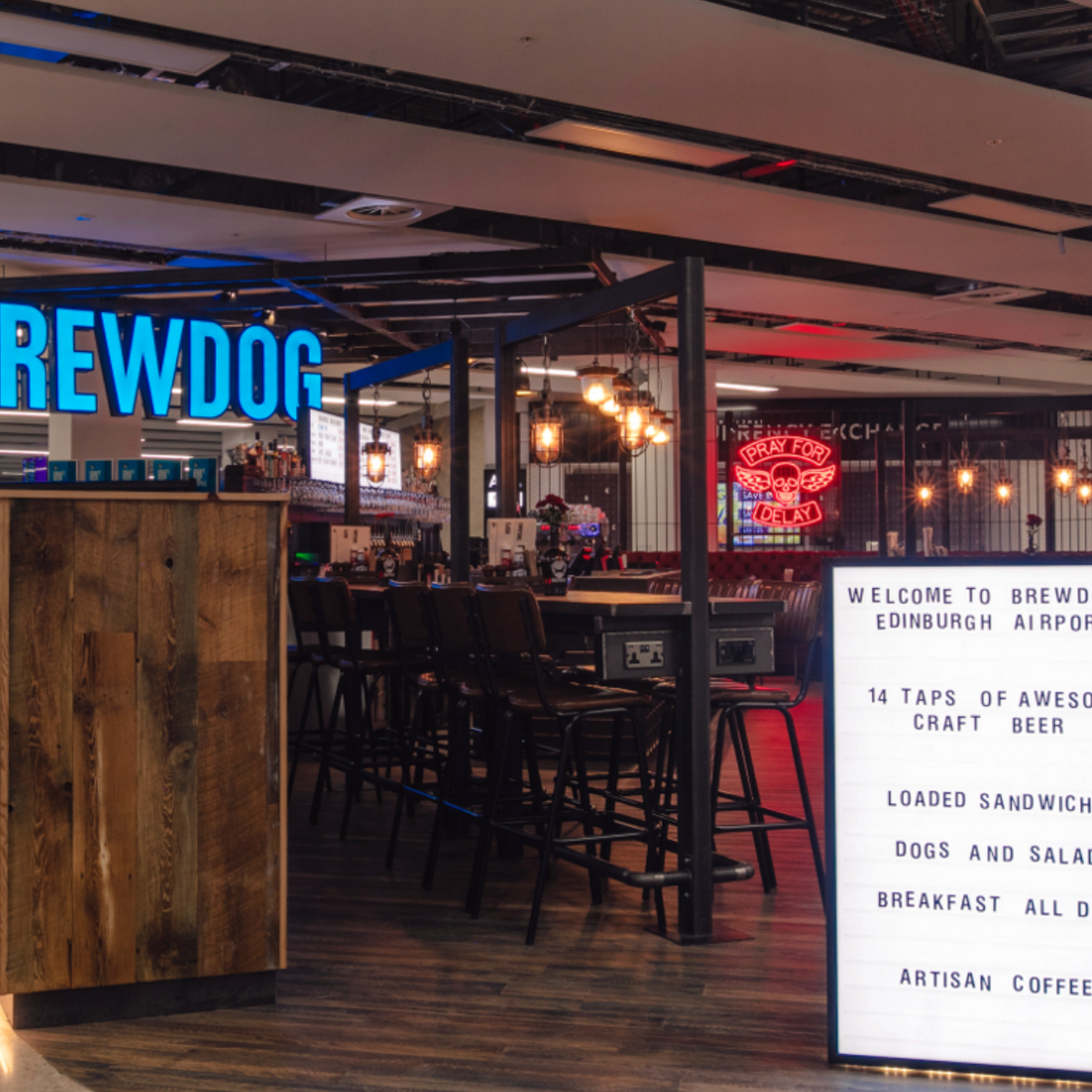 Vibrant BrewDog bar in Edinburgh Airport, ideal for networking and casual dining.