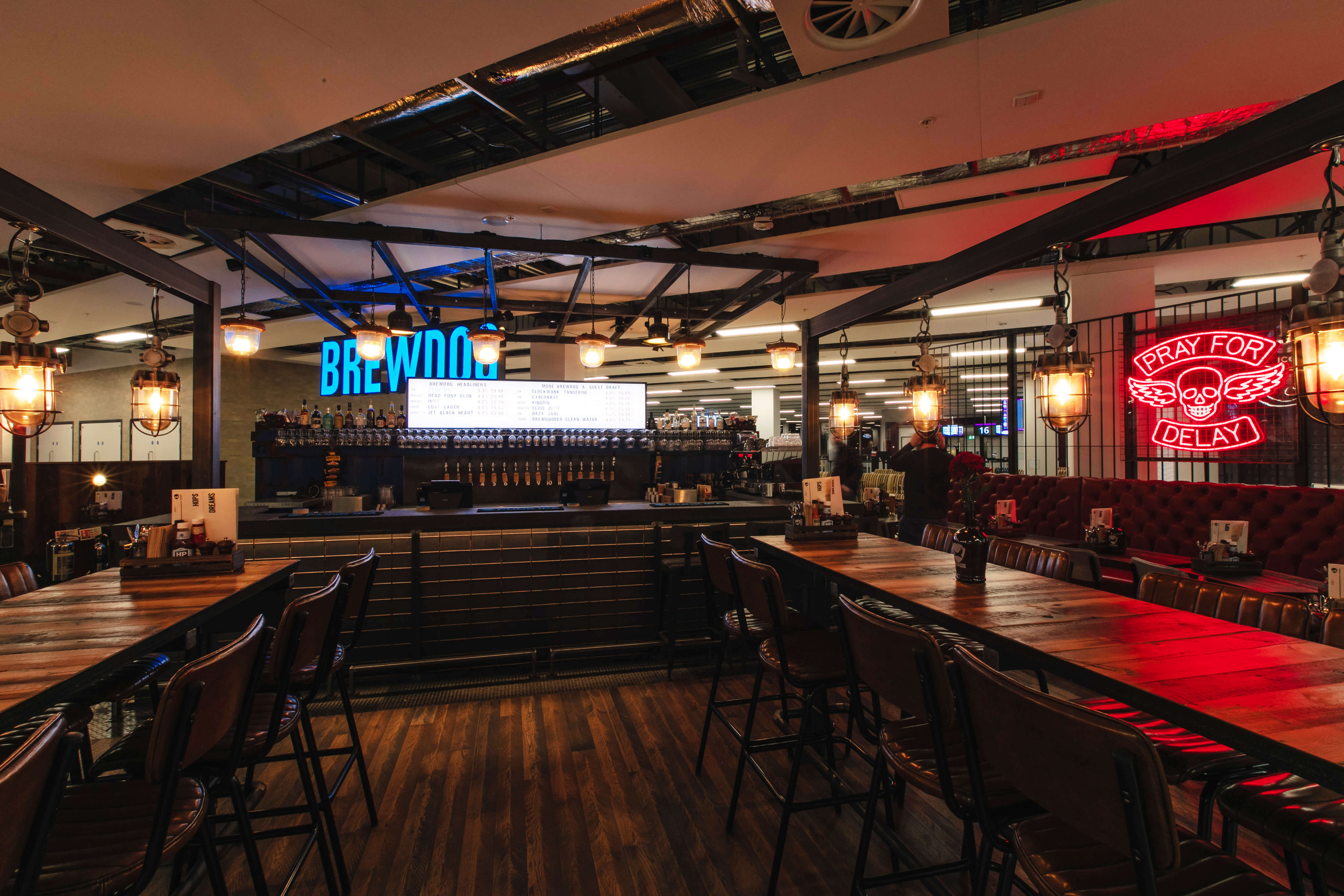 BrewDog Edinburgh Airport bar with spacious seating for networking events and gatherings.
