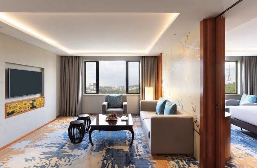 Modern hotel suite in China Hotel, Guangzhou, ideal for business meetings and gatherings.