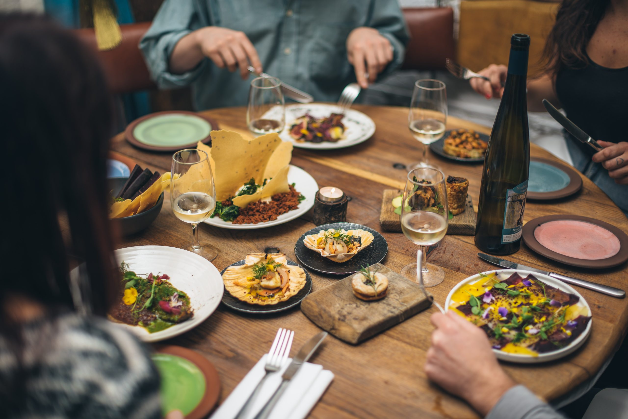 Elegant dining table with gourmet dishes for networking events at The GOAT Chelsea.