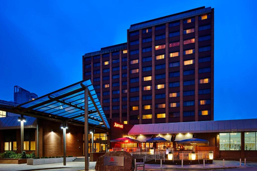 "Cardiff Marriott hotel at dusk, modern architecture, ideal for events and meetings."