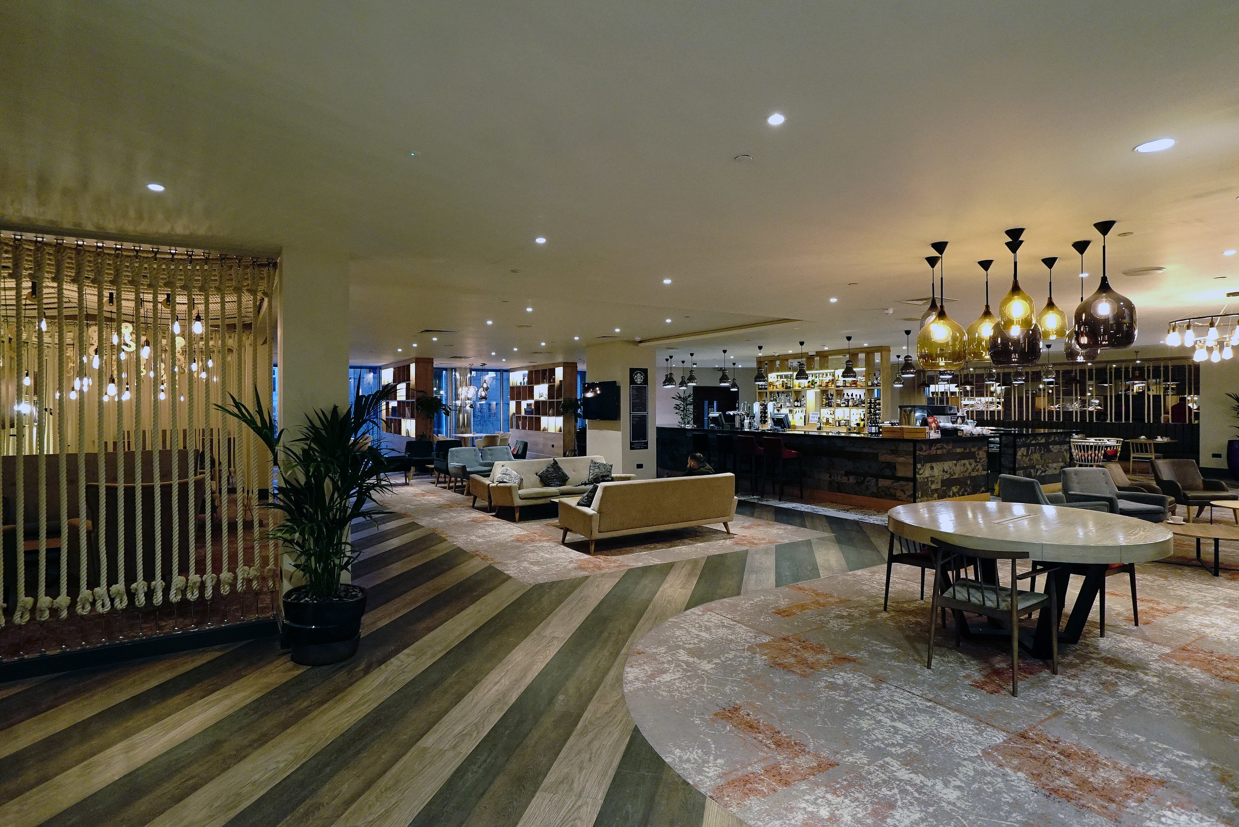 Modern lobby at Mercure Cardiff, ideal for networking and casual meetings.