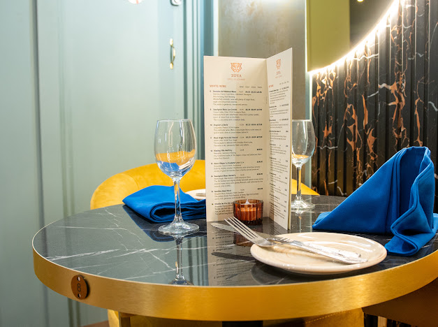 Elegant dining table at ZOYA GRILL & LOUNGE for intimate meetings and events.