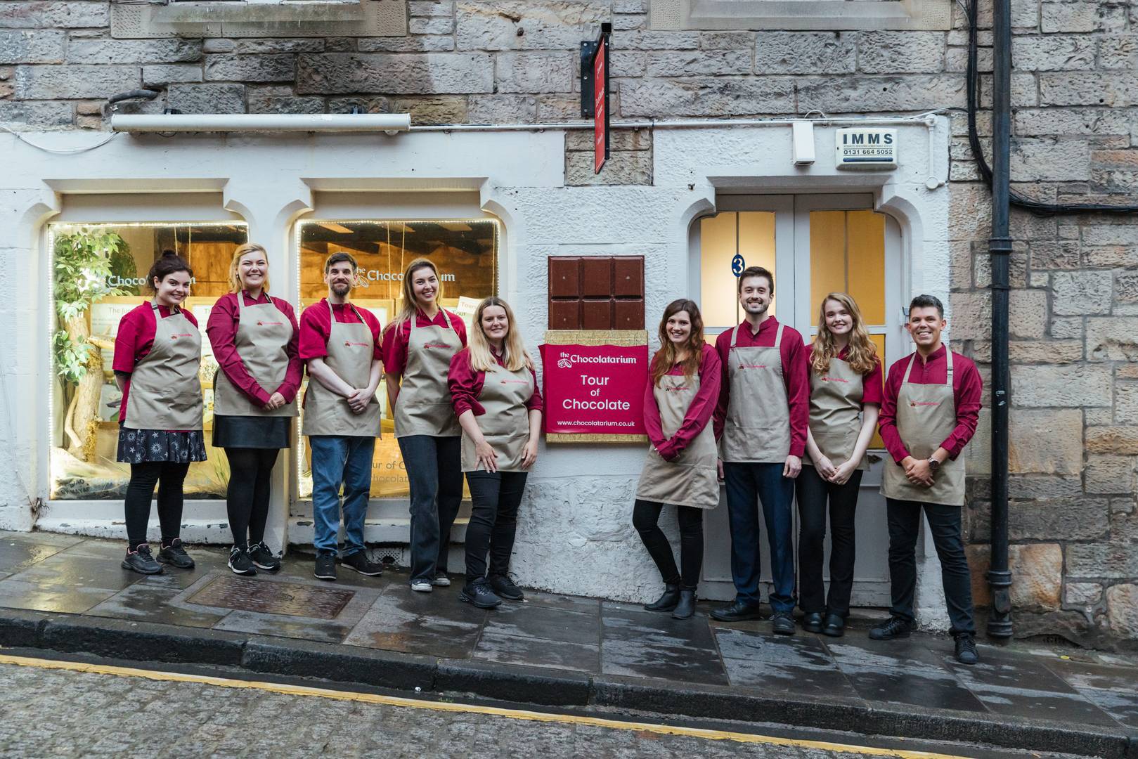 Corporate team-building event at The Chocolatarium with staff in matching aprons.