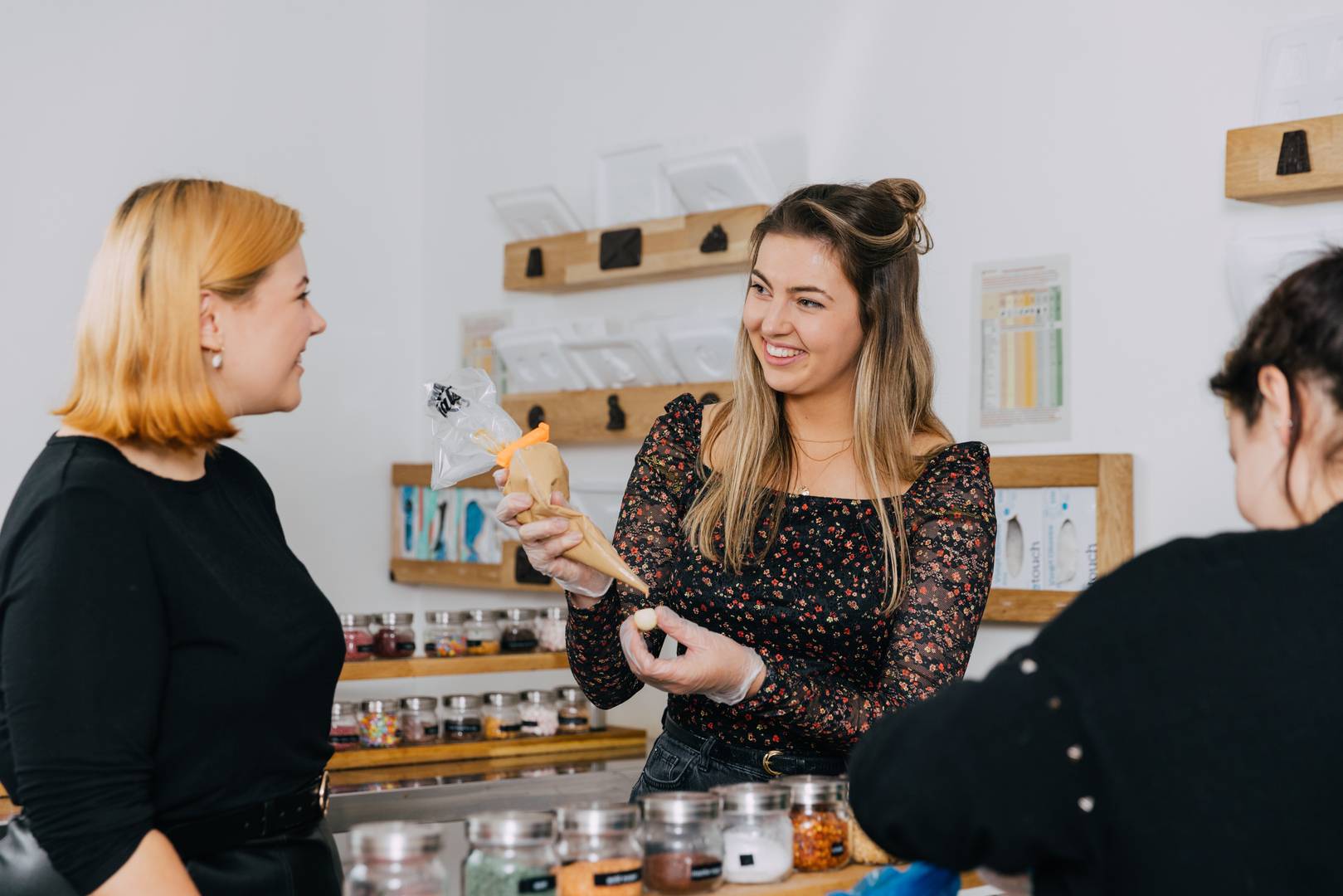 Interactive chocolate workshop with smiling facilitator, ideal for team-building events.