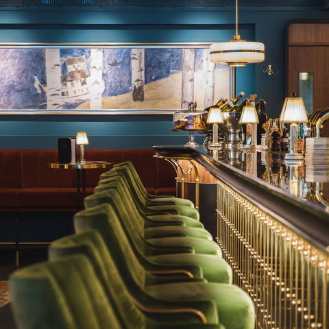 Main Dining Area at Bar du Champagne with plush seating, ideal for networking events.