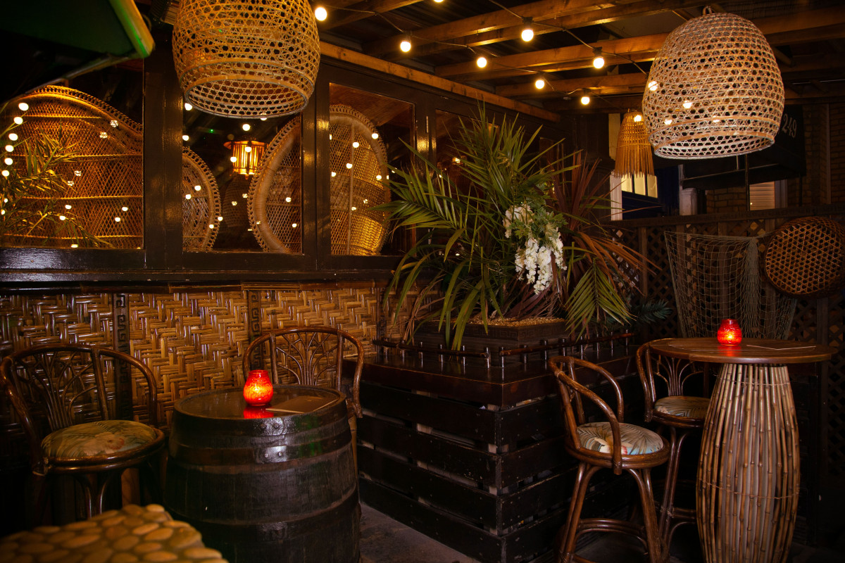 Cozy Kai Wai Cove at Sugar Cane Tiki, perfect for intimate gatherings and networking.