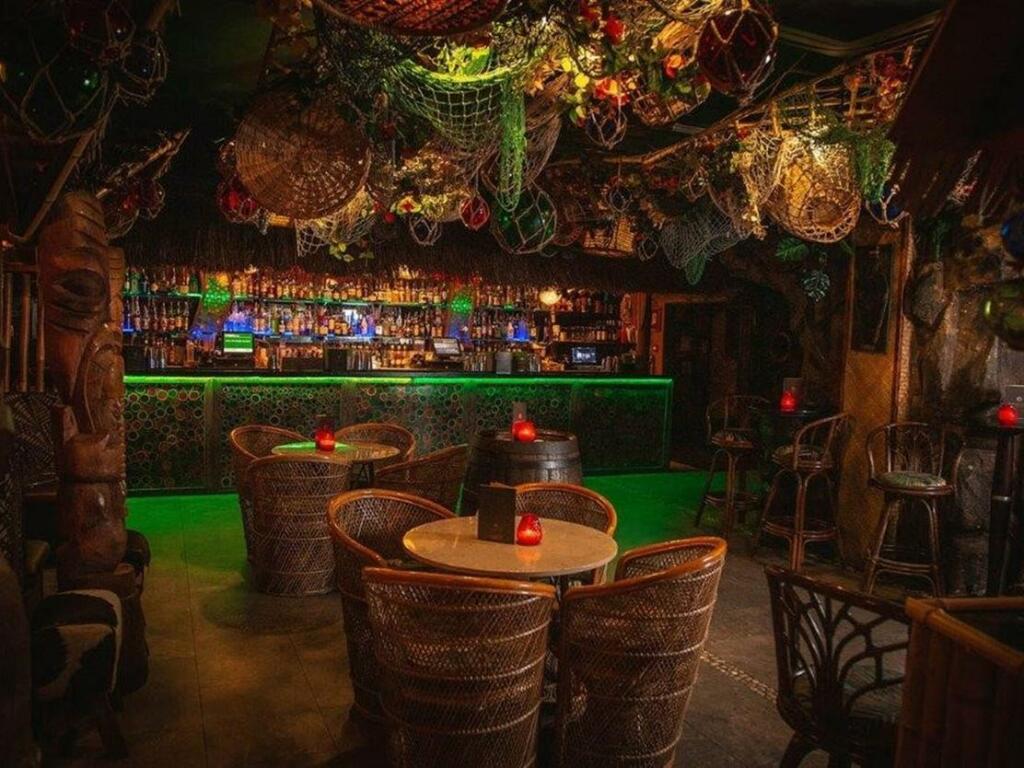 Kai Wai Cove at Sugar Cane Tiki Bar, vibrant tiki decor for unique events and parties.