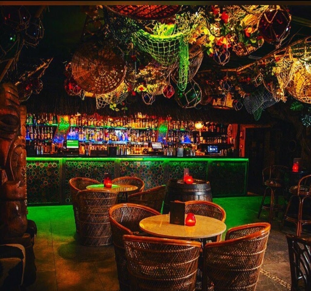 Vibrant Tiki Cocktail Bar with colorful decor, ideal for networking events and social gatherings.