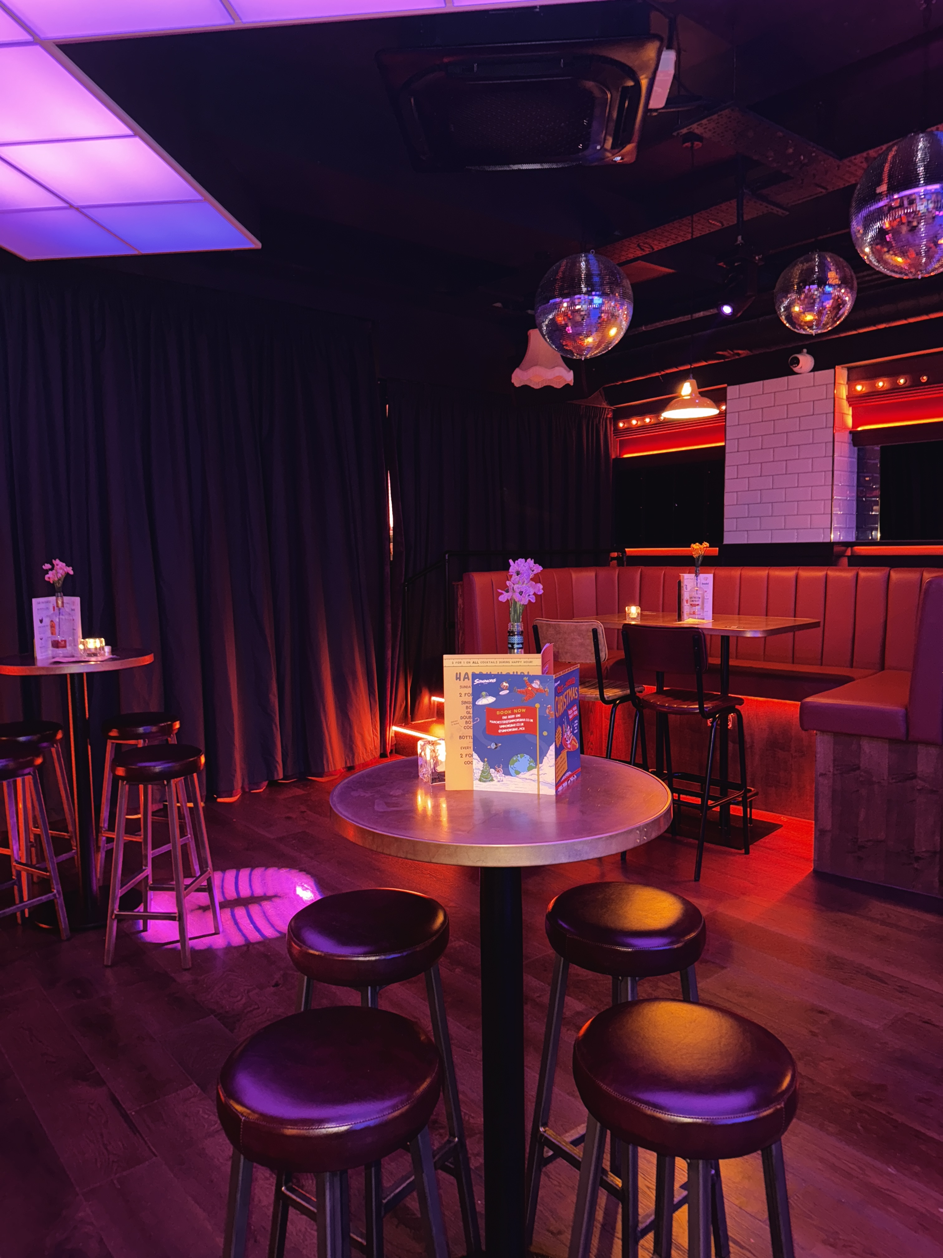Half Venue in Simmons Manchester: vibrant space with cozy seating for networking events.