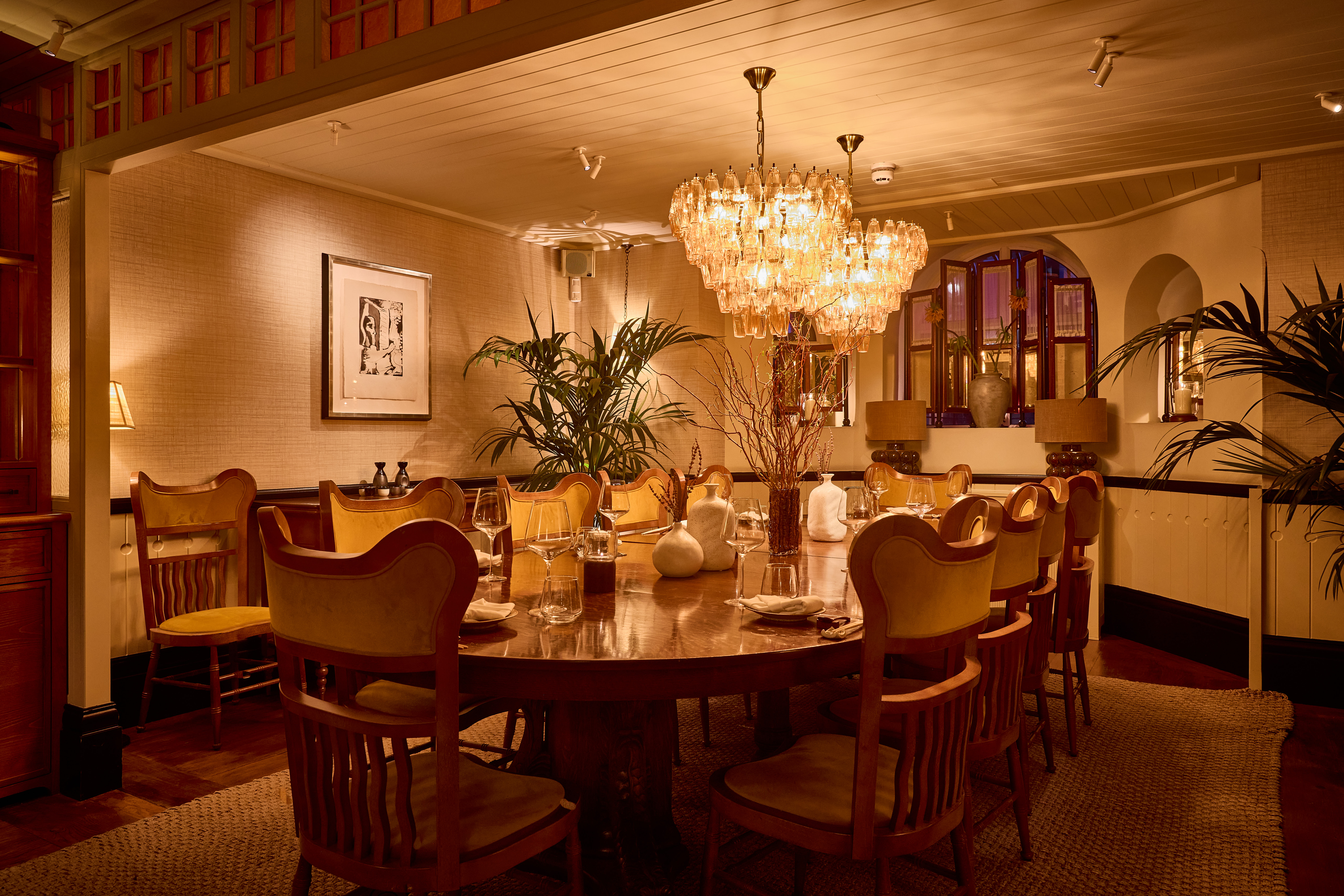 Elegant private dining room with round table for intimate events at NIJŪ.