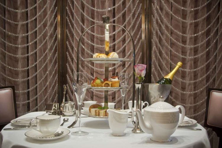 Elegant afternoon tea setup at Oval Restaurant, luxury hotel in Knightsbridge, London.