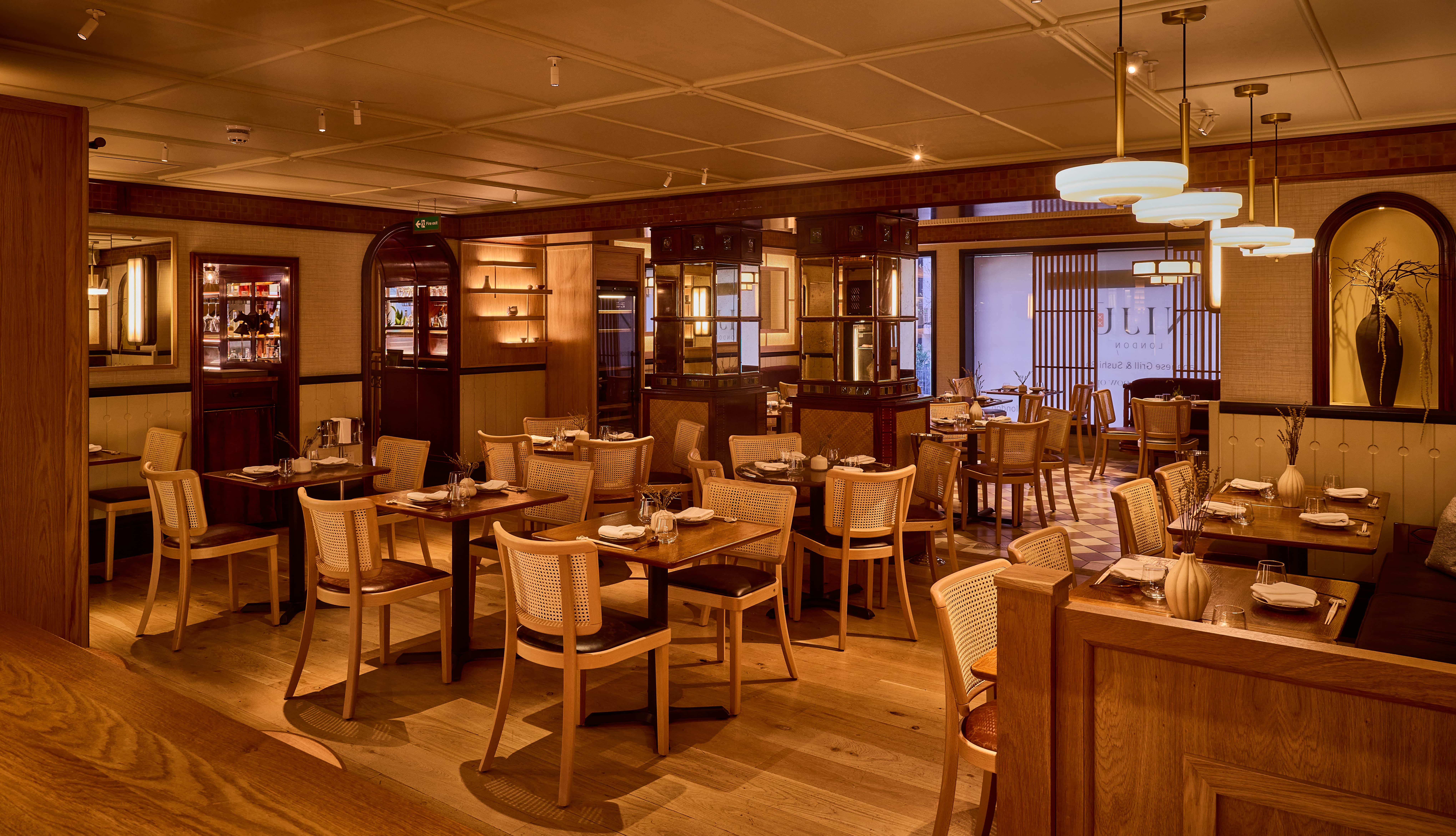 Sophisticated dining space with warm wood tones for intimate meetings and events.