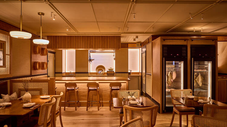 Elegant restaurant interior with warm wood tones, ideal for corporate events and private gatherings.