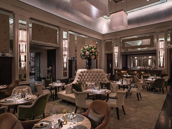 Elegant dining space in Palm Court, The Langham London for upscale events and meetings.