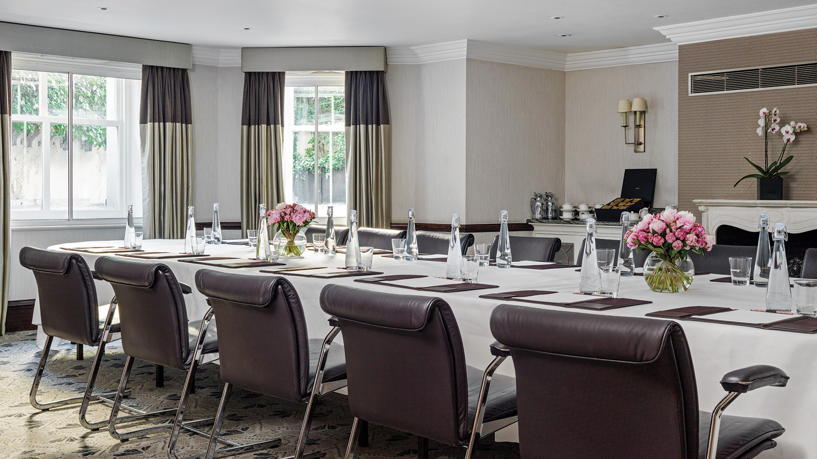 Elegant meeting room at The Langham, London with natural light for corporate events.