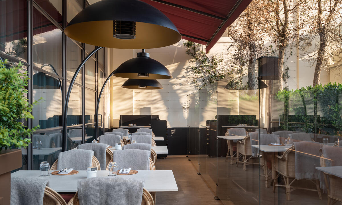 Le Magritte Bar & Terrace outdoor dining area with modern design for events and meetings.