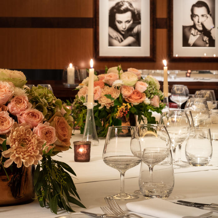 Elegant dining table with floral arrangements in Sargent Room, perfect for upscale events.