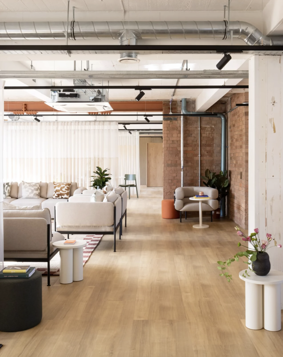 Modern event space with natural light, perfect for meetings and networking.