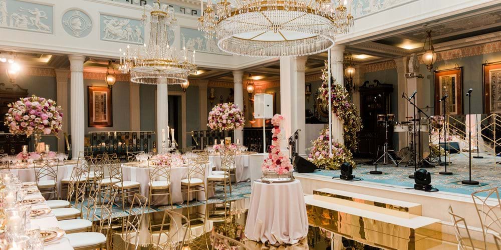 Belgravia Ballroom, elegant wedding venue with chandeliers and floral decor.