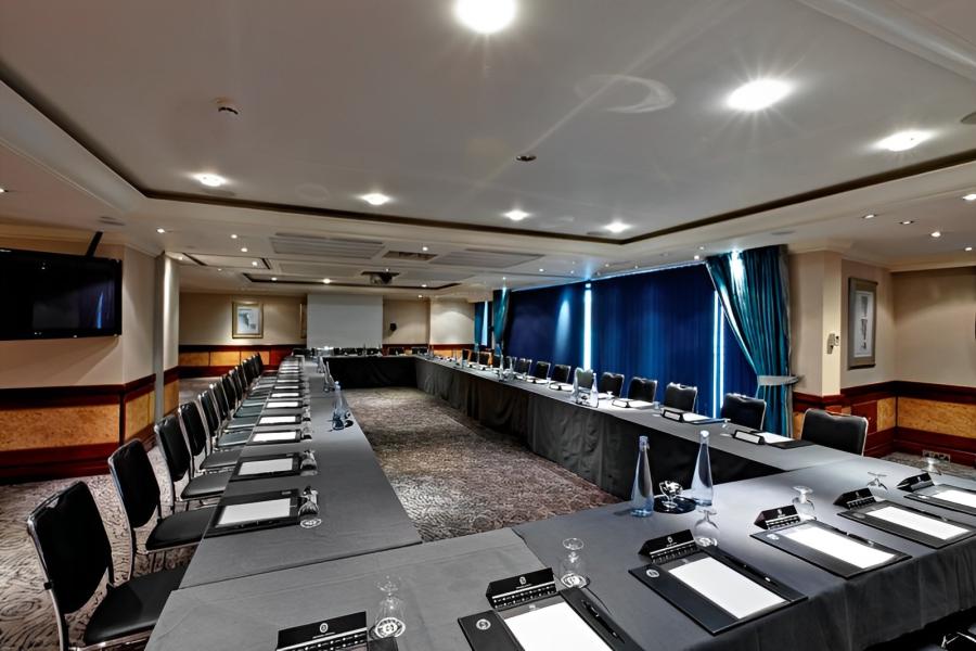 Green Park Meeting Room with U-shaped table, ideal for corporate meetings and workshops.