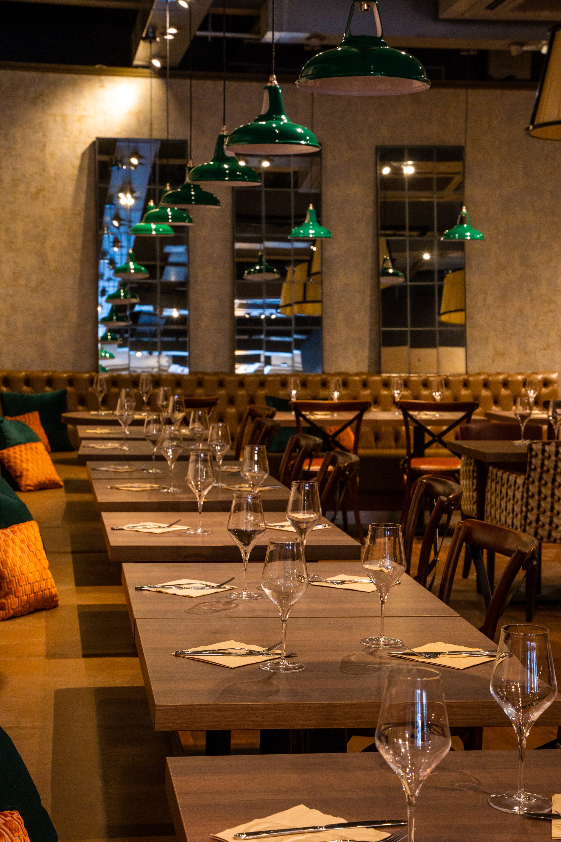 Semi-private dining space with elegant table settings for intimate events at Top Hat Restaurant.