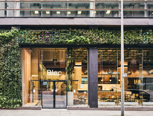 Modern auditorium with green facade, perfect for meetings and events.