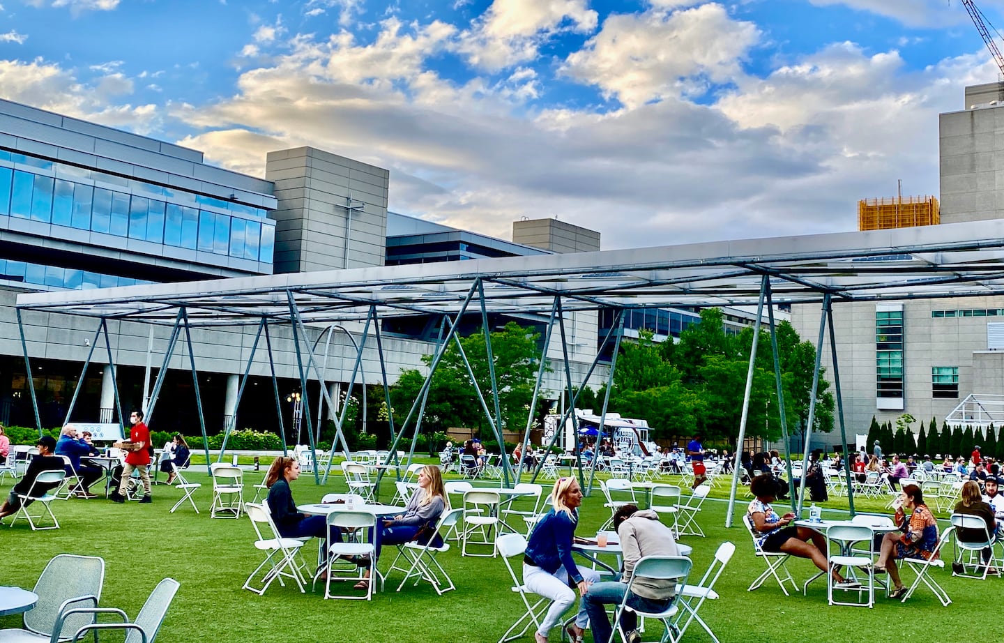 Vibrant outdoor event space with modern architecture, ideal for receptions and gatherings.