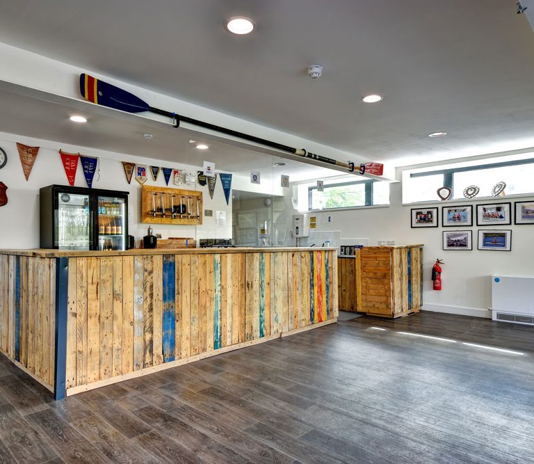 Cambridge Boat Club's Club Room: rustic event space with natural light for gatherings.