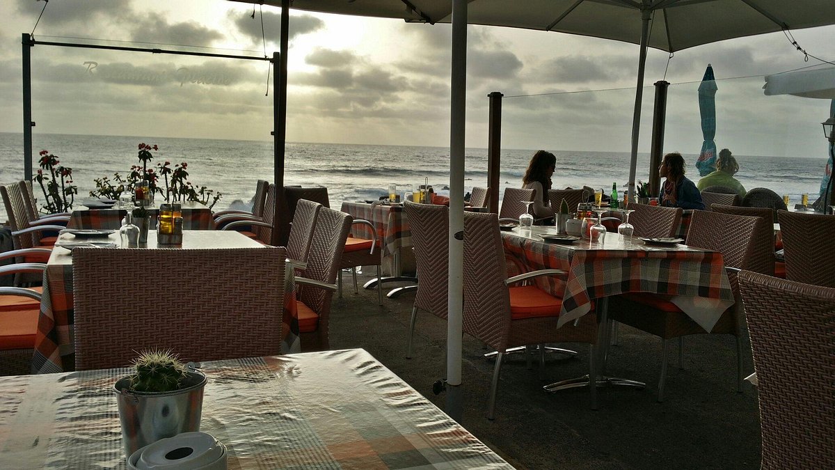 Beachfront restaurant in La Gamba with cozy dining setup for casual events.