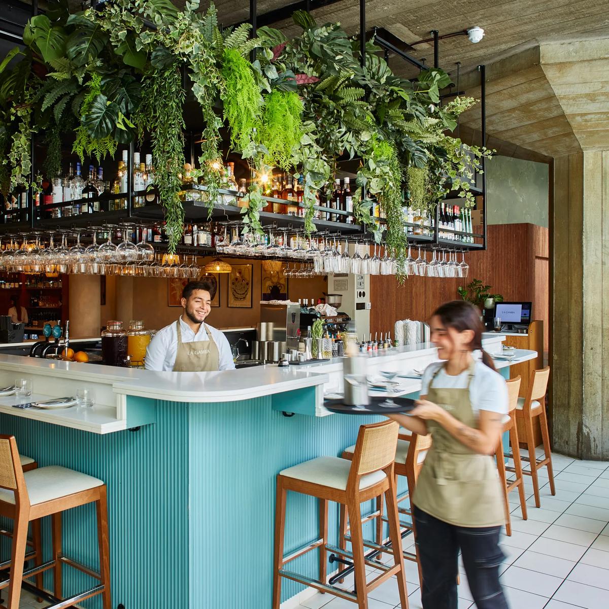 Vibrant dining room bar in La Gamba, ideal for networking events and social gatherings.