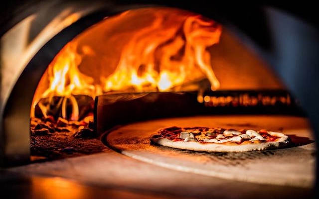 Wacky Wombat wood-fired pizza oven in Daroco Soho for engaging culinary events.