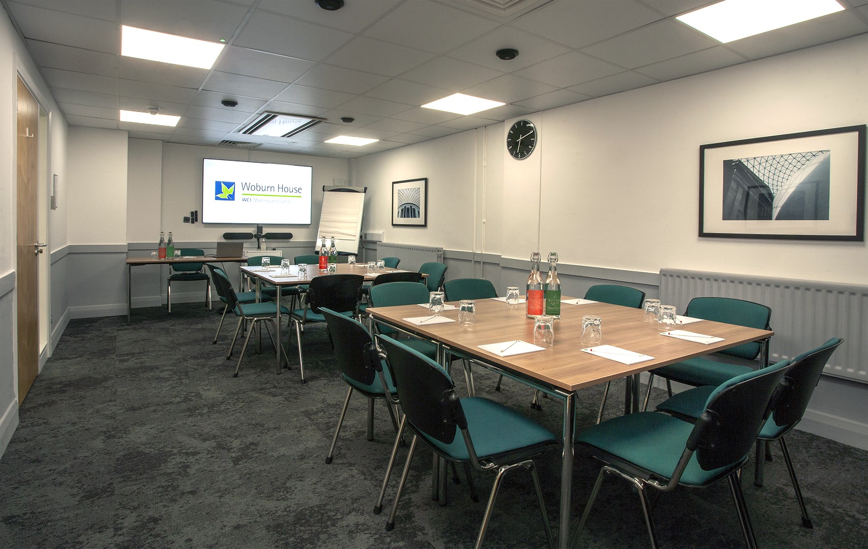 Foster and Bloomsbury Rooms, Woburn House: corporate meeting space with presentation screen.