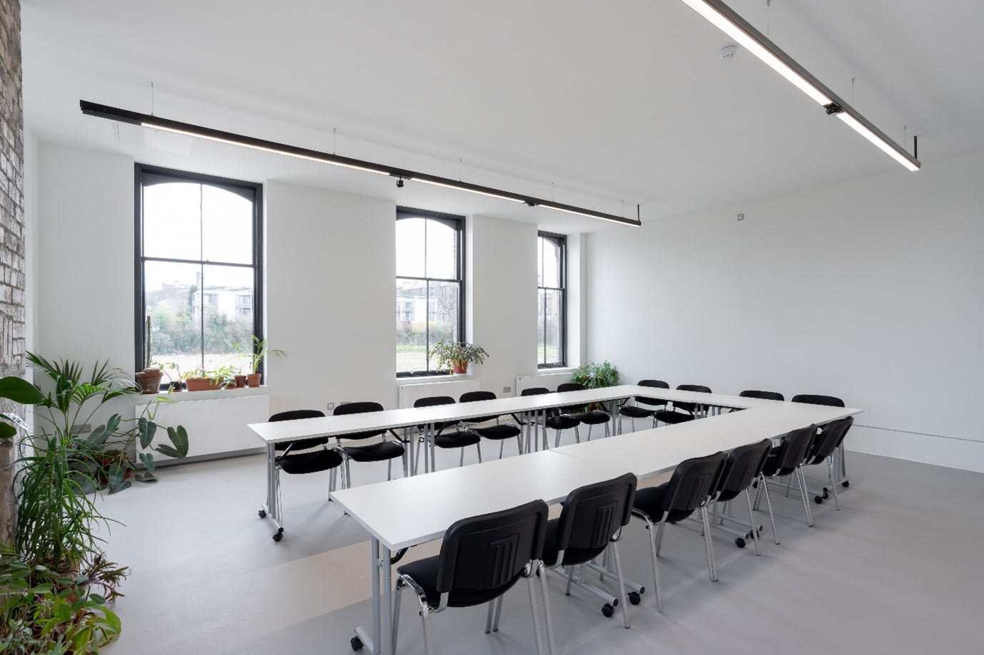 Modern meeting room with ergonomic chairs for workshops at Edinburgh Printmakers.
