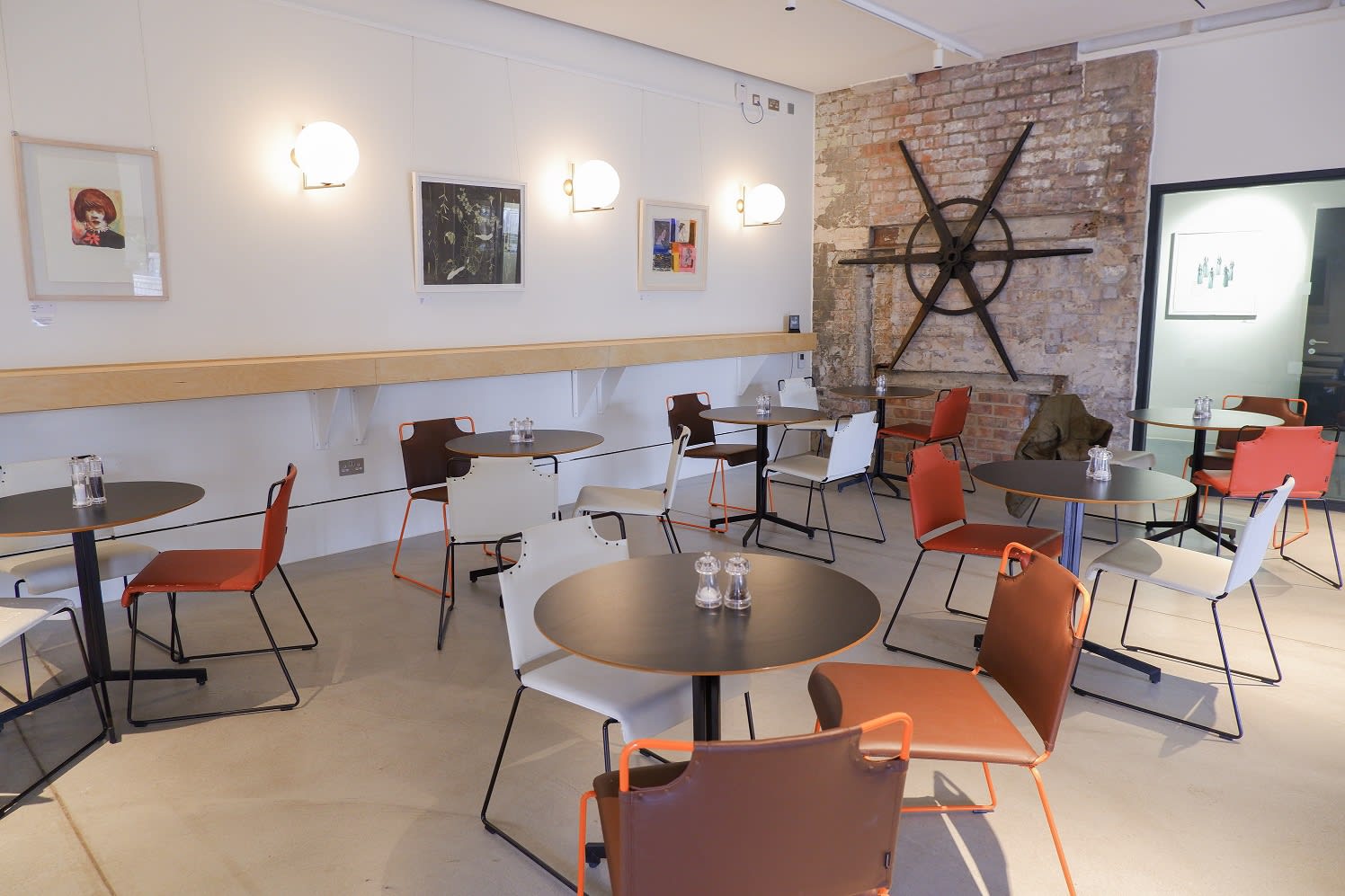 Modern event space with warm lighting at Edinburgh Printmakers for networking and workshops.
