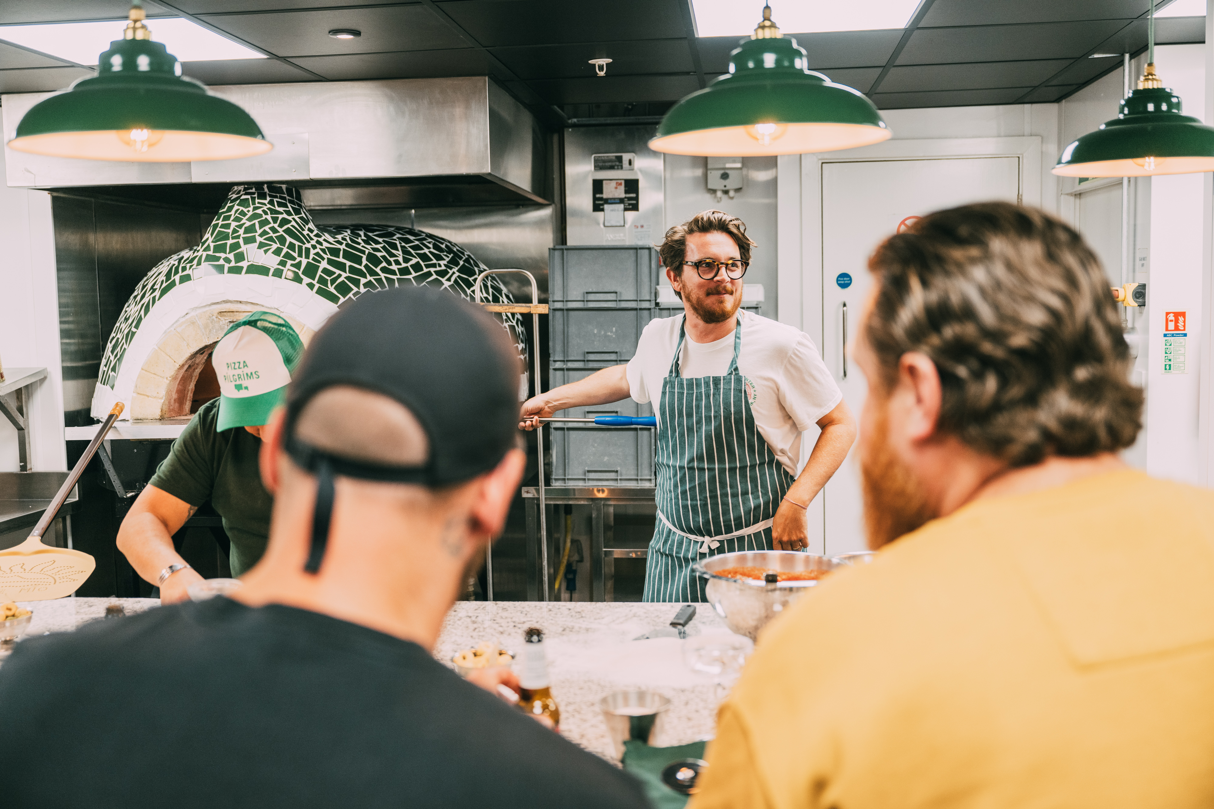 Dough It Yourself pizza making workshop at Pizza Pilgrims, featuring an interactive kitchen.