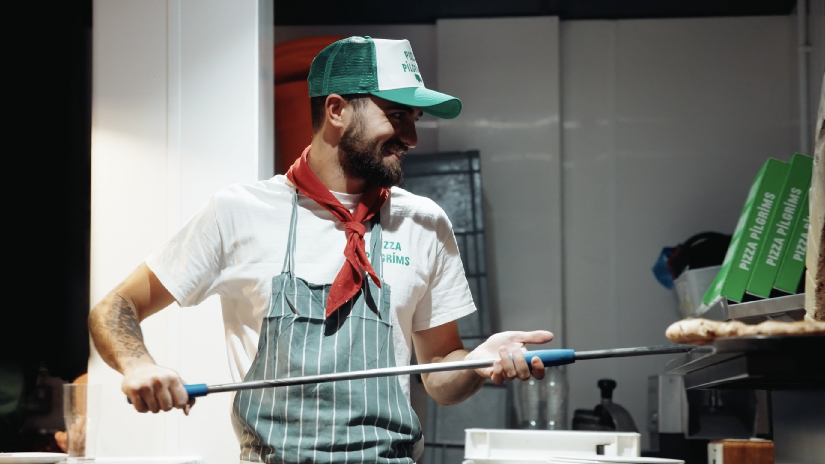 "Interactive pizza making event with vibrant chef at Pizza Pilgrims."