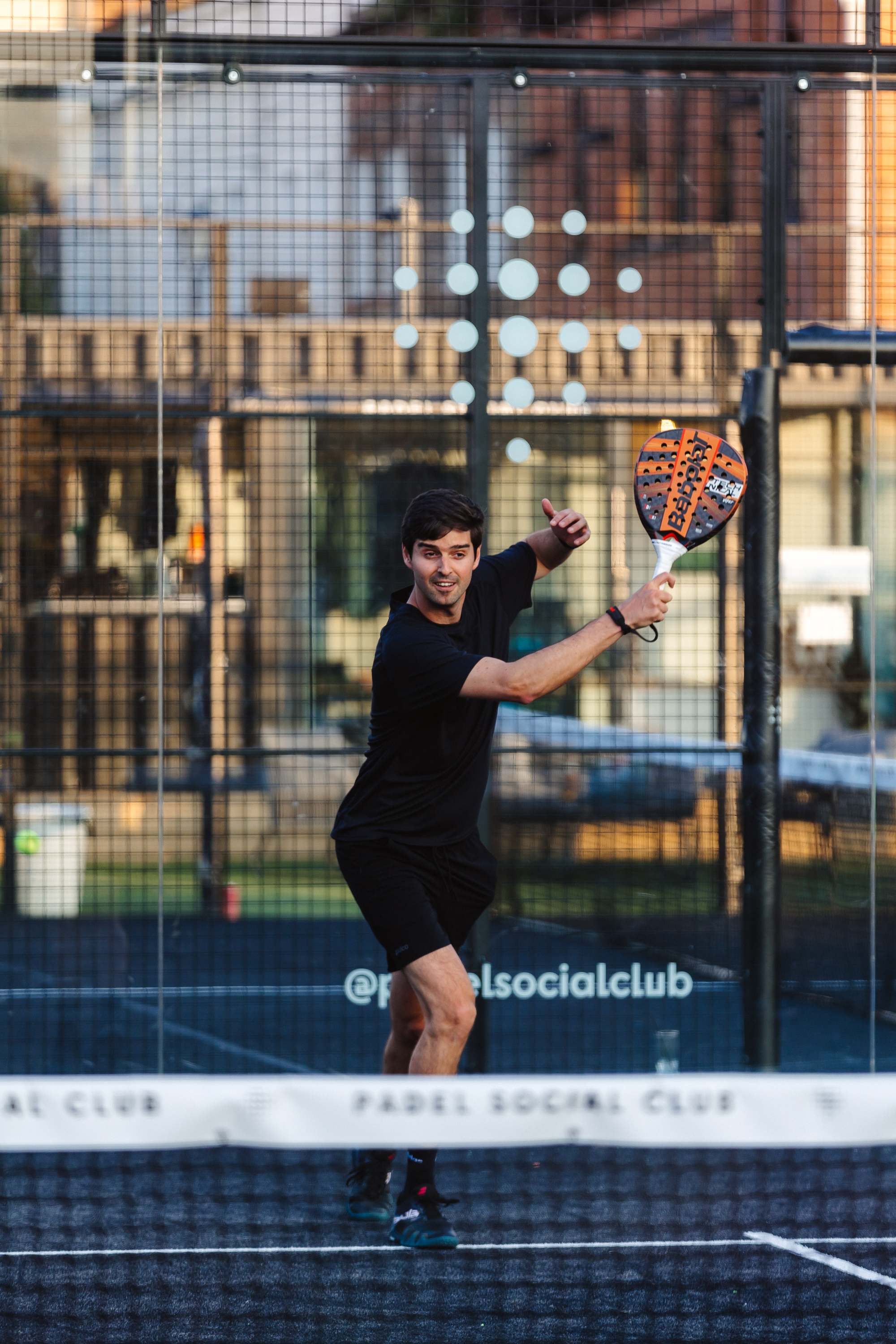 "Active team-building at Padel Social Club venue with networking opportunities."