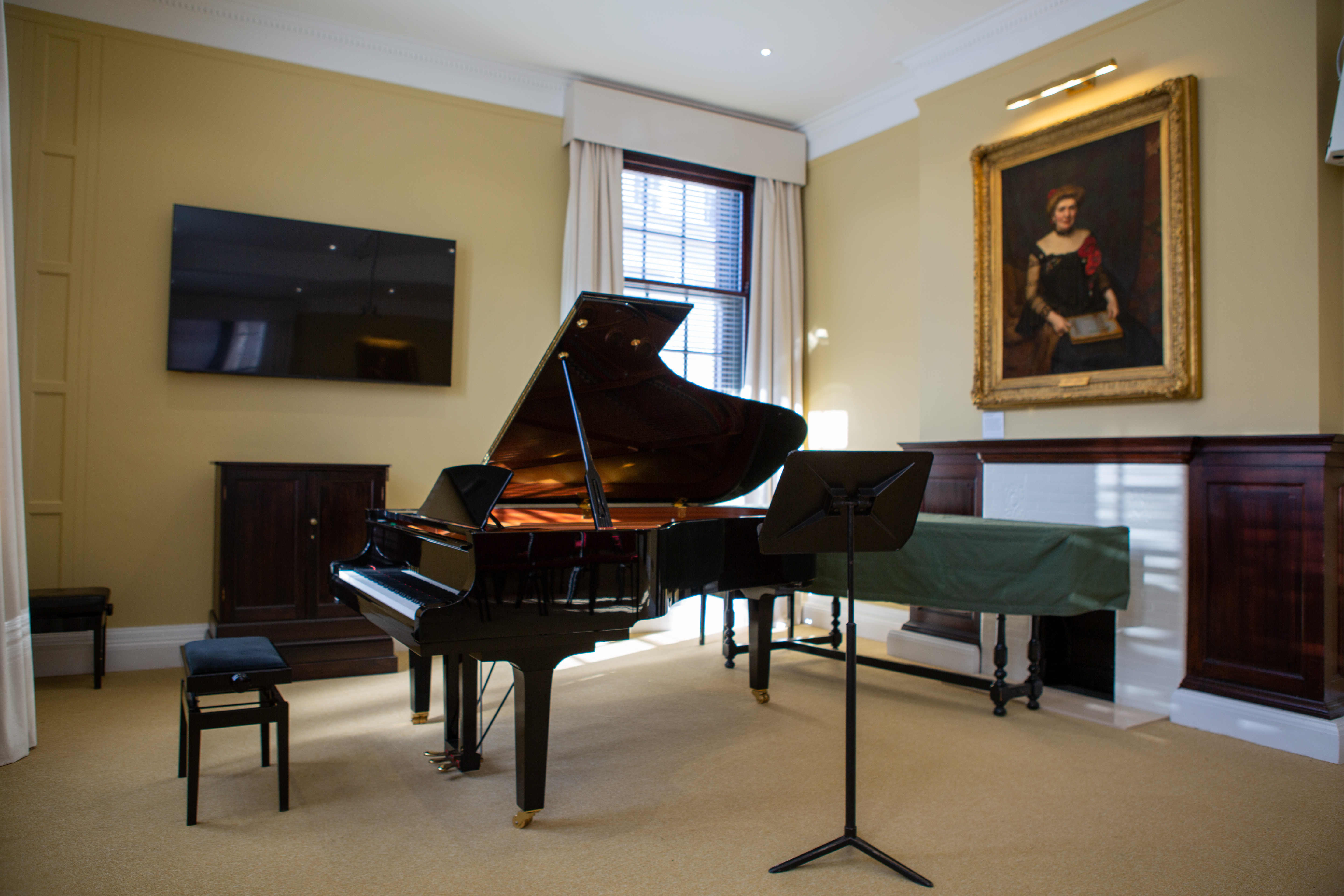 Forsyth Room at Royal Academy of Music with grand piano for elegant events and concerts.
