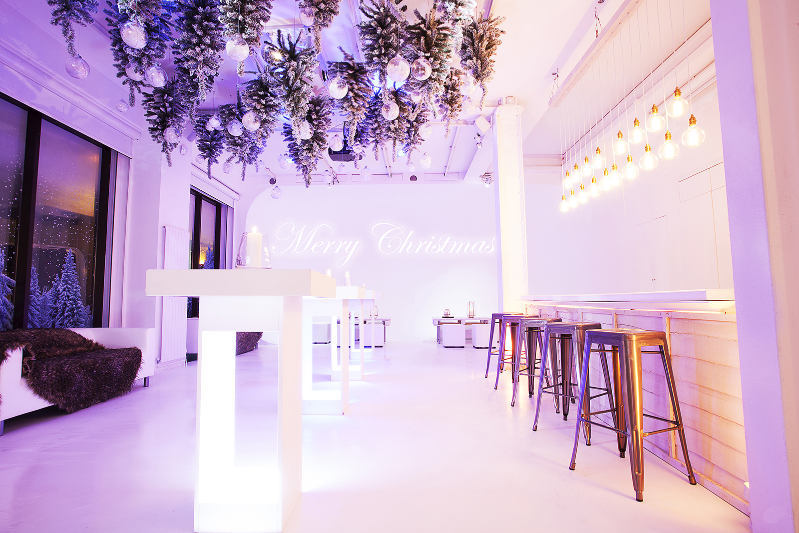 Stylish Christmas party venue with elegant decor and warm lighting for festive gatherings.