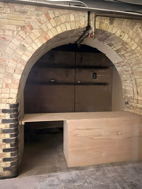 Exclusive Hire event space with arched brick structure, ideal for intimate gatherings.