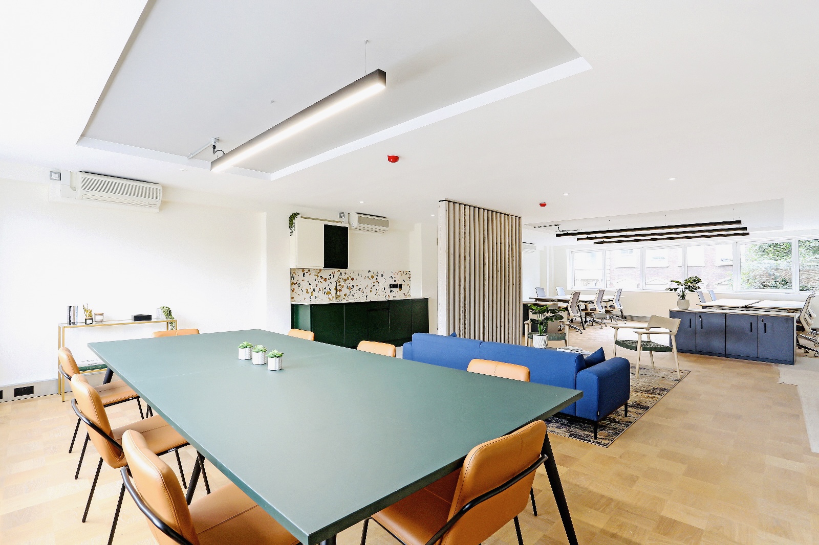 Modern meeting room in Phoenix House with natural light for workshops and team meetings.