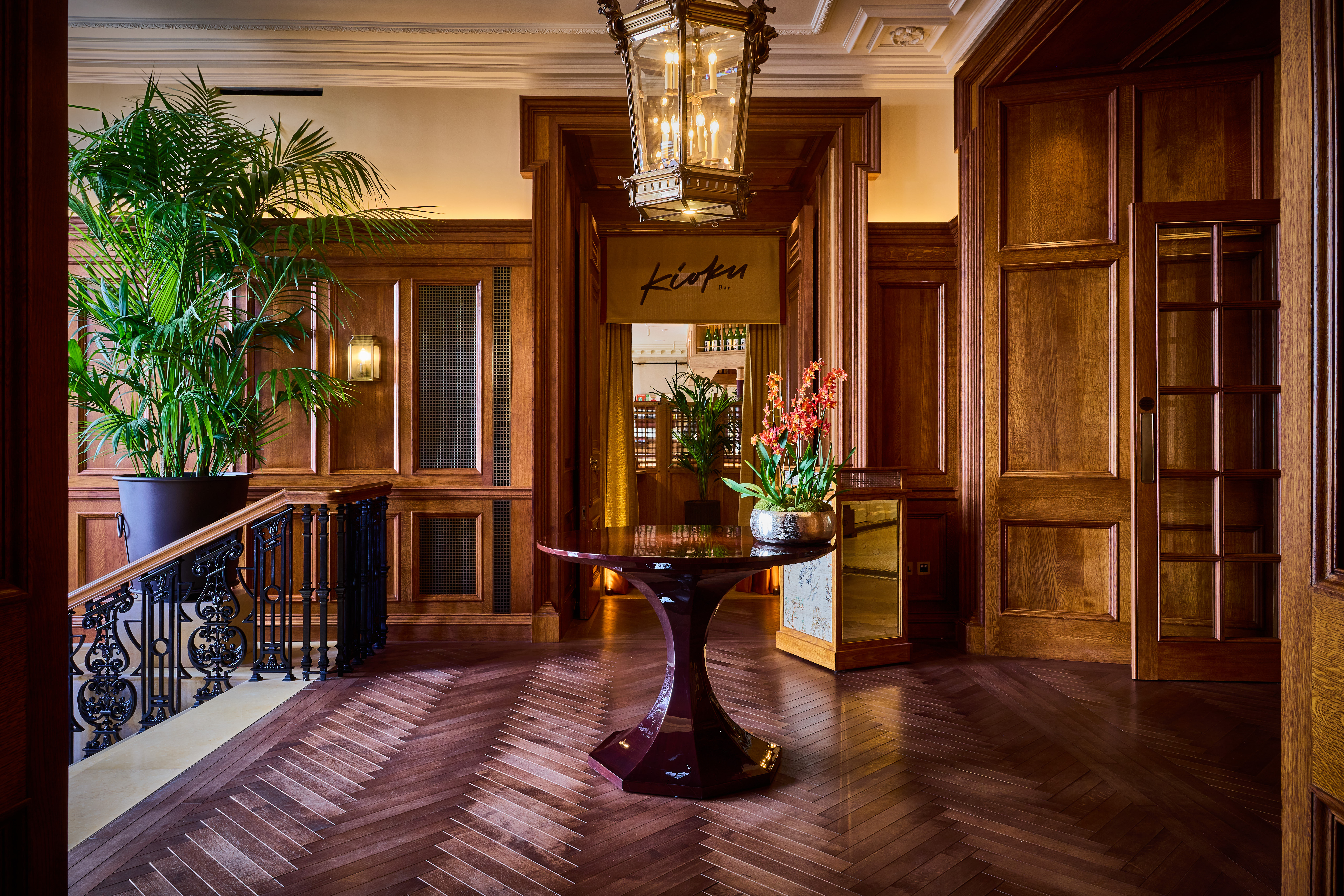 Elegant entryway of Kioku Bar, featuring rich wood and polished floors for upscale events.