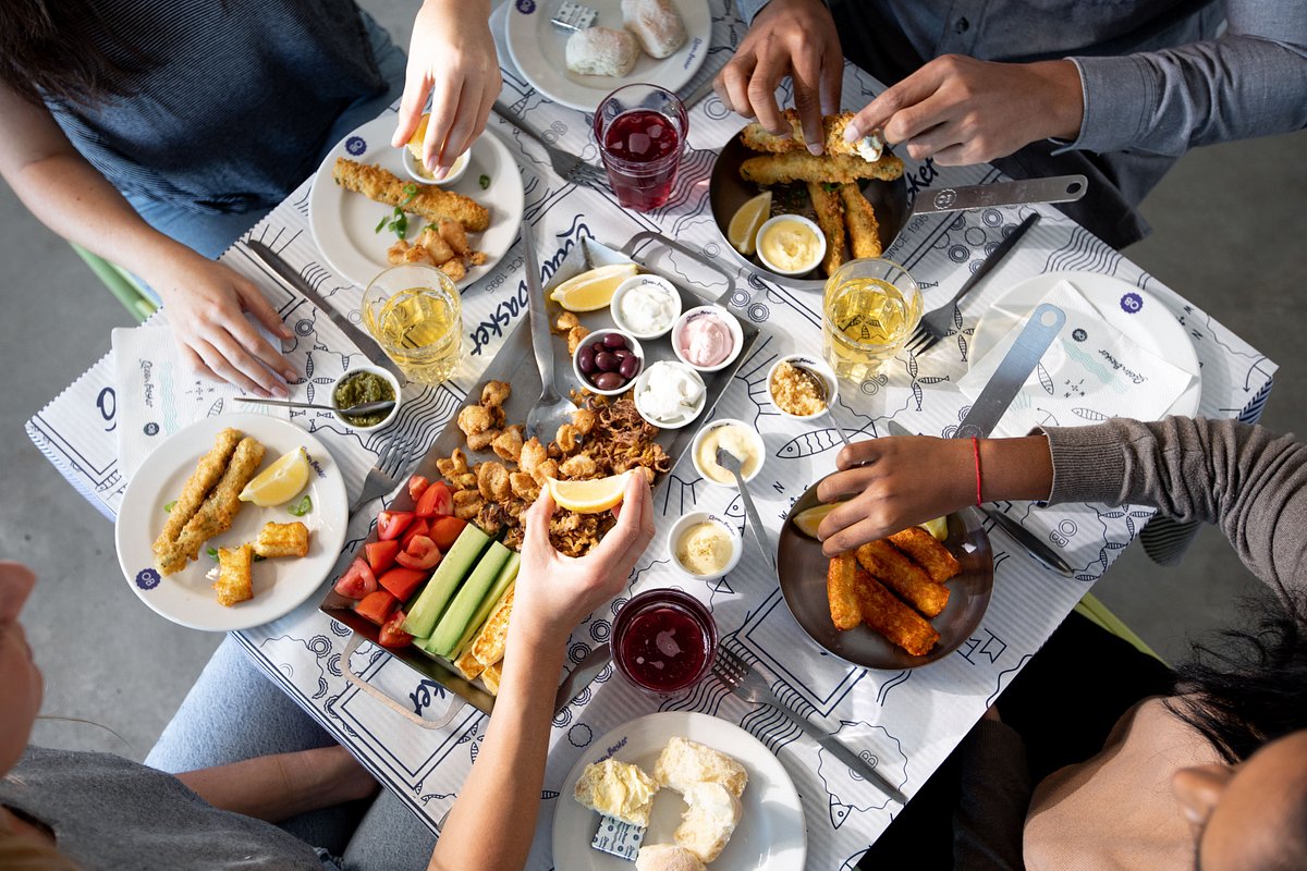 Vibrant communal dining at Ocean Basket UK, ideal for networking and team-building events.