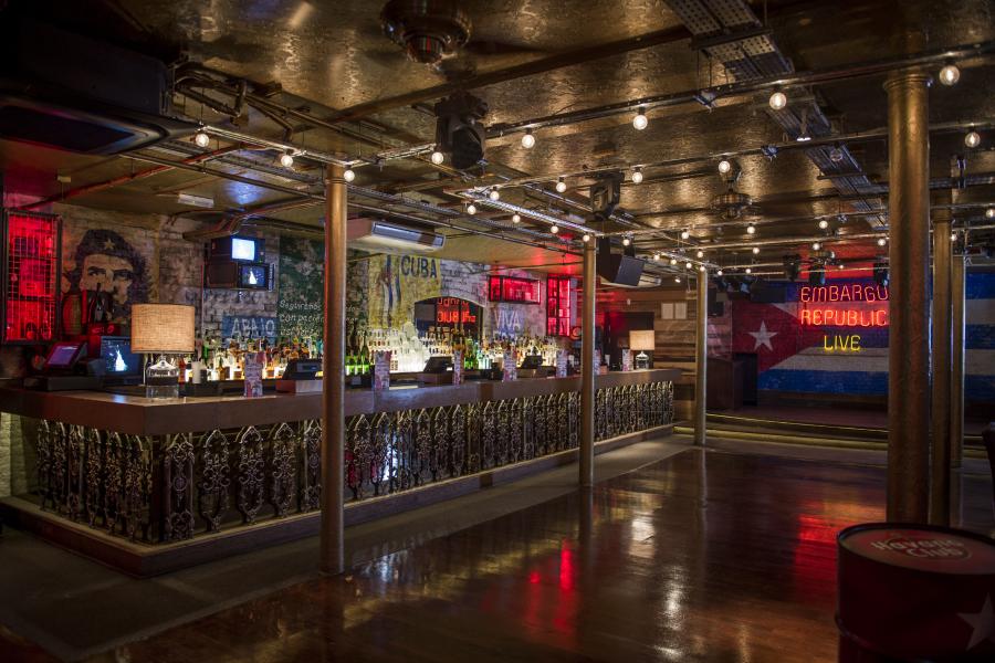 Vibrant cocktail bar with eclectic decor, perfect for themed events and gatherings.