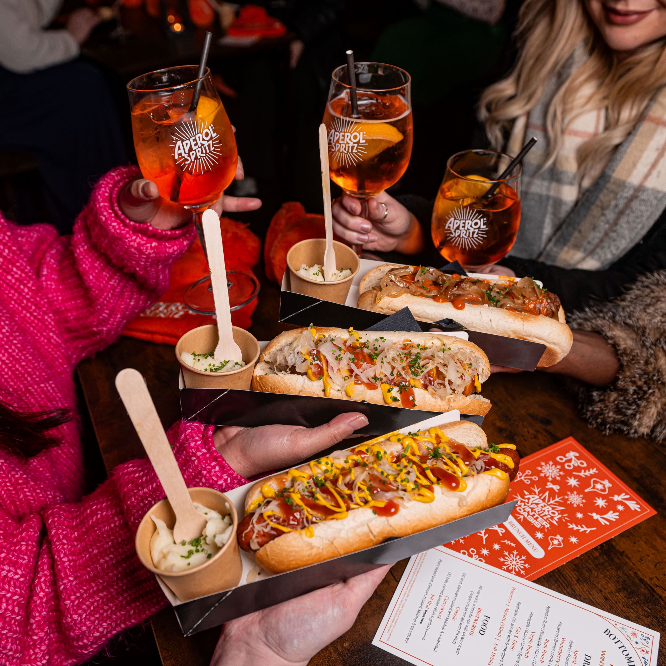 Winter Oasis in The Dome: vibrant networking event with gourmet hot dogs and cocktails.