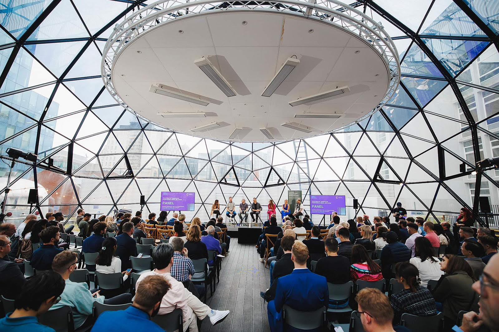 Modern event space with geometric architecture for conferences and workshops.