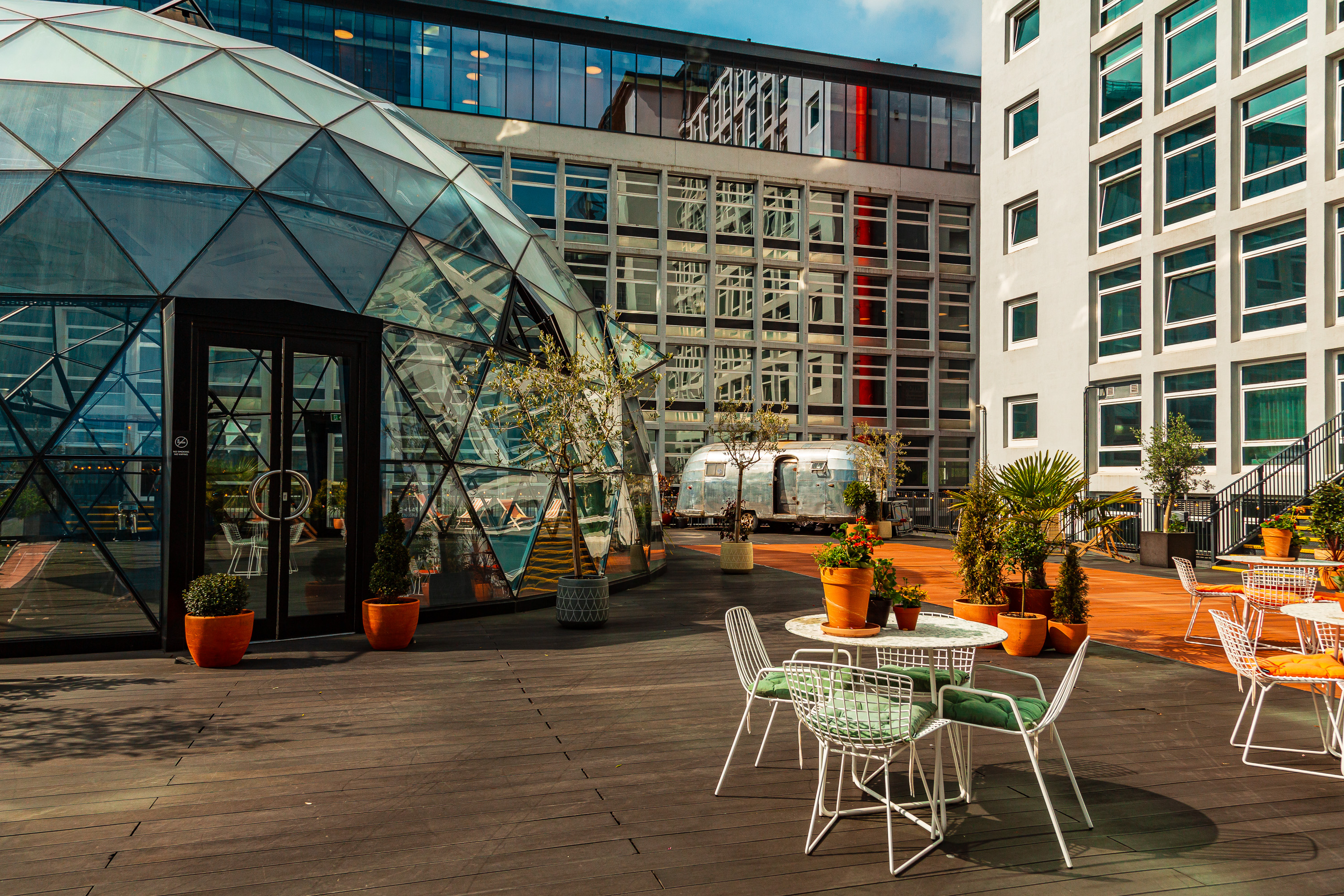 Modern geodesic dome event space with stylish seating for meetings and gatherings.